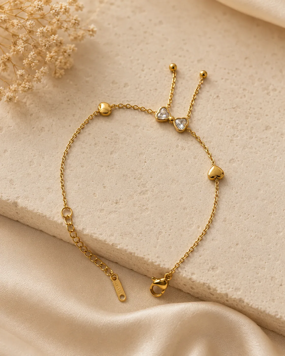 Amora Golden Heart Bracelet, a gold-tone bracelet with crystal heart accents
