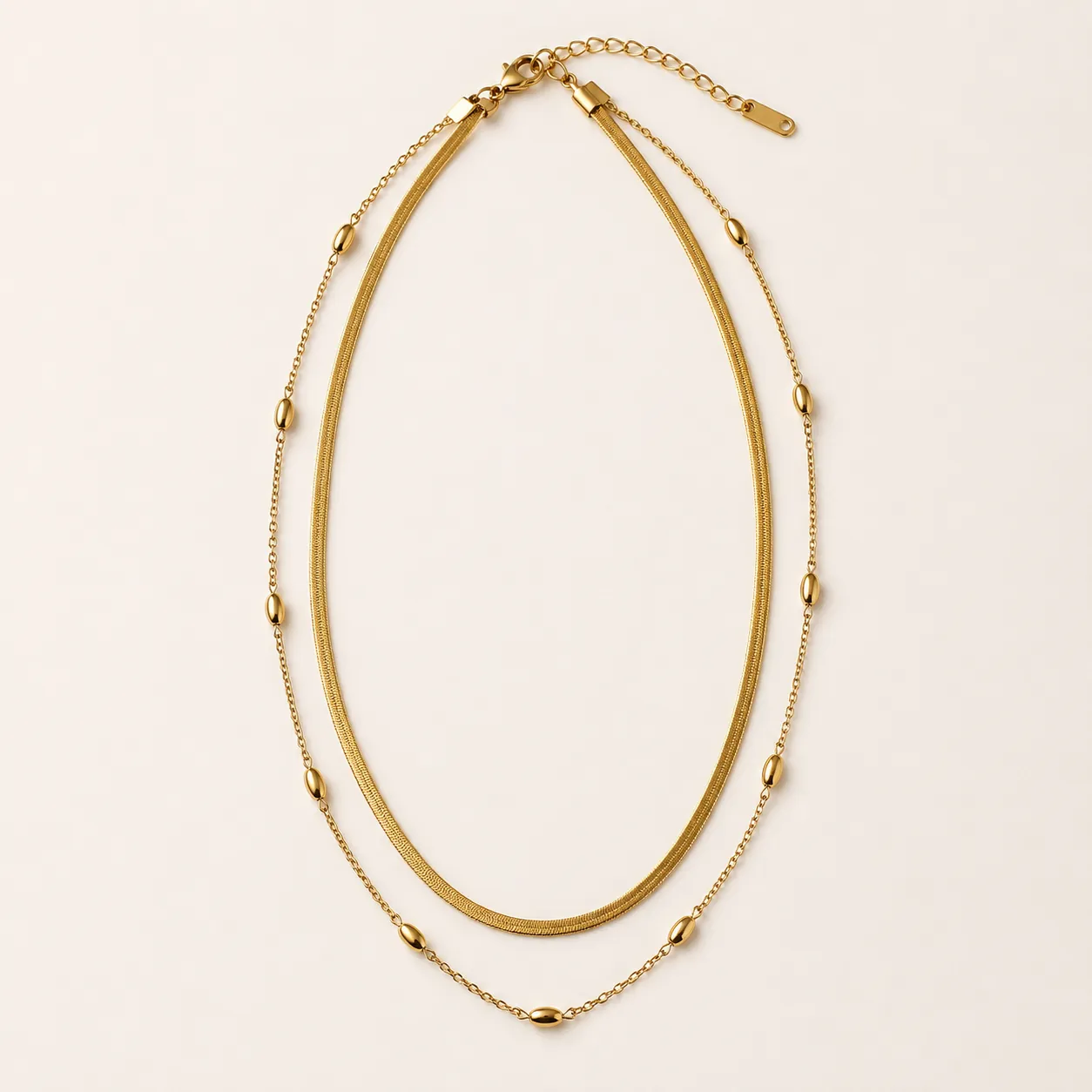 Mehr Layered Gold Necklace, a gold-toned flat chain with a delicate beaded strand